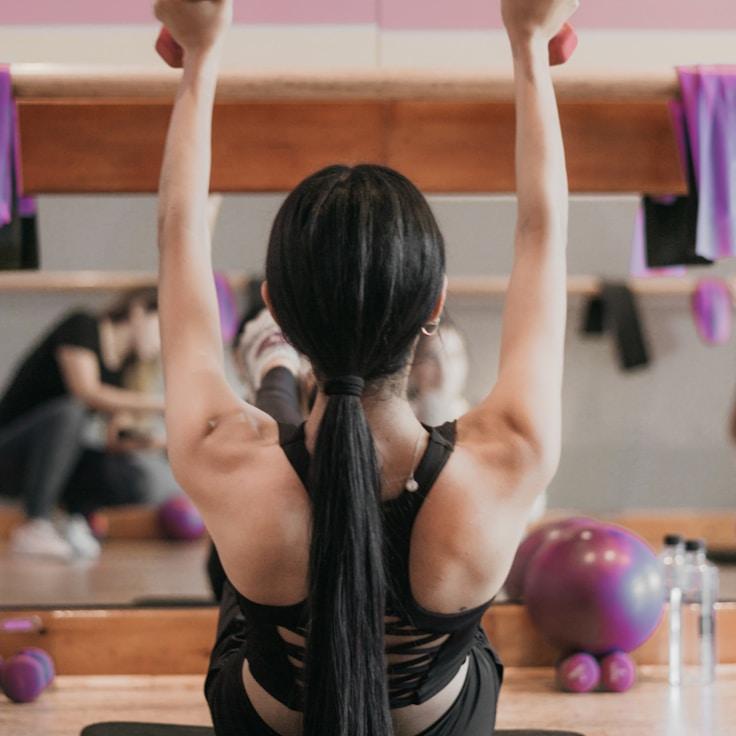Group fitness class in a modern studio environment